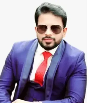 Vineet Kumar Nigam, a leader at MyDailyChoice, in a professional suit and sunglasses.