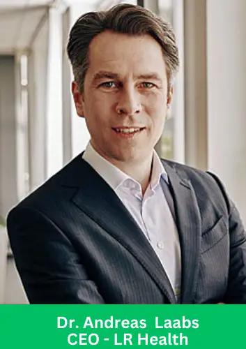Dr. Andreas Laabs, CEO of LR Health & Beauty, wearing a dark suit and smiling confidently in a professional office setting.