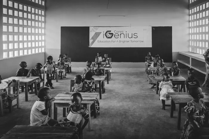 Children sitting in a newly established classroom at the iGenius Cares preschool in Togo, Africa, fostering education and a brighter future.
