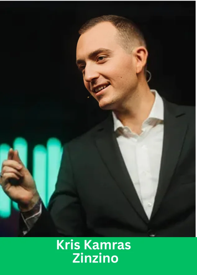 Kris Kamras, Royal Ambassador at Zinzino, speaking on stage in a black suit
