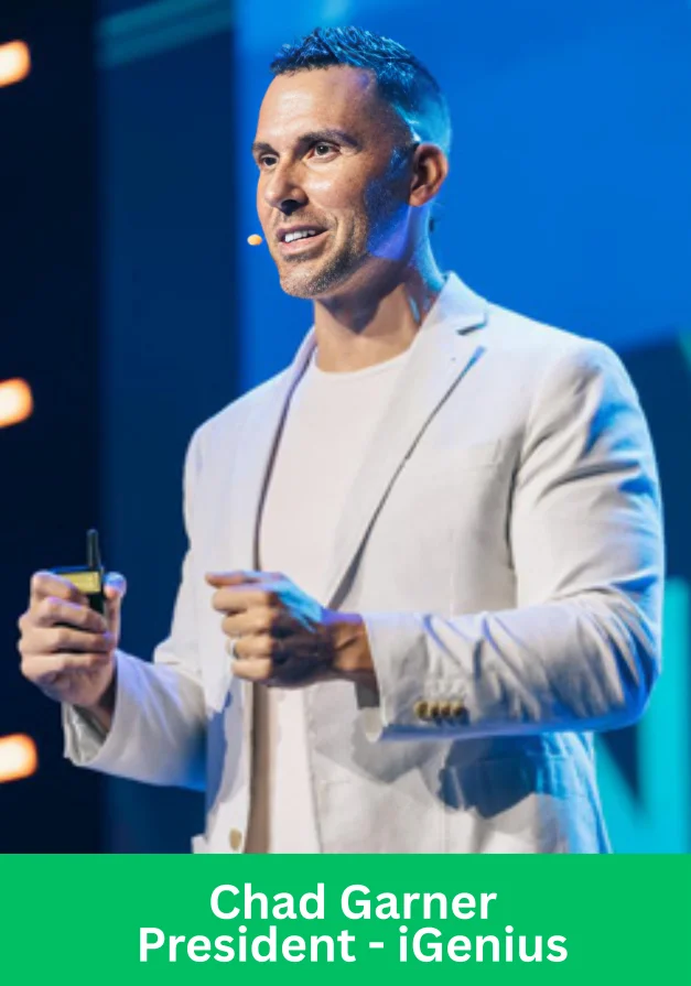Chad Garner, President of iGenius, speaking on stage during a leadership event
