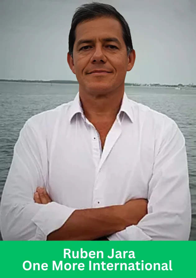 Ruben Jara standing confidently by the water as a top leader at One More International