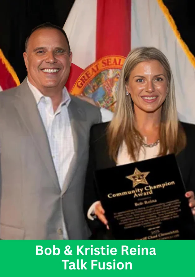 Bob and Kristie Reina holding an award during Talk Fusion Global Launch event