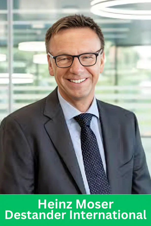 Heinz Moser, CEO of Destander International, smiling in a professional suit