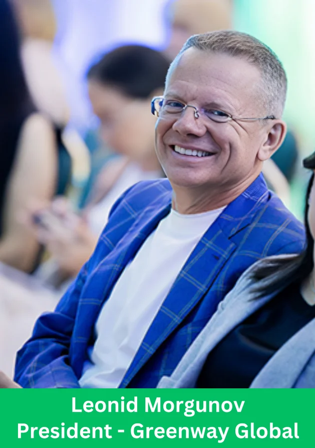 Leonid Morgunov, President of Greenway Global, attending a company leadership event and smiling at the audience