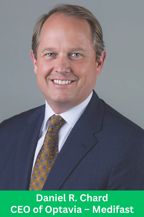 A business executive in a suit posing for a professional portrait for an Optavia Medifast leadership feature