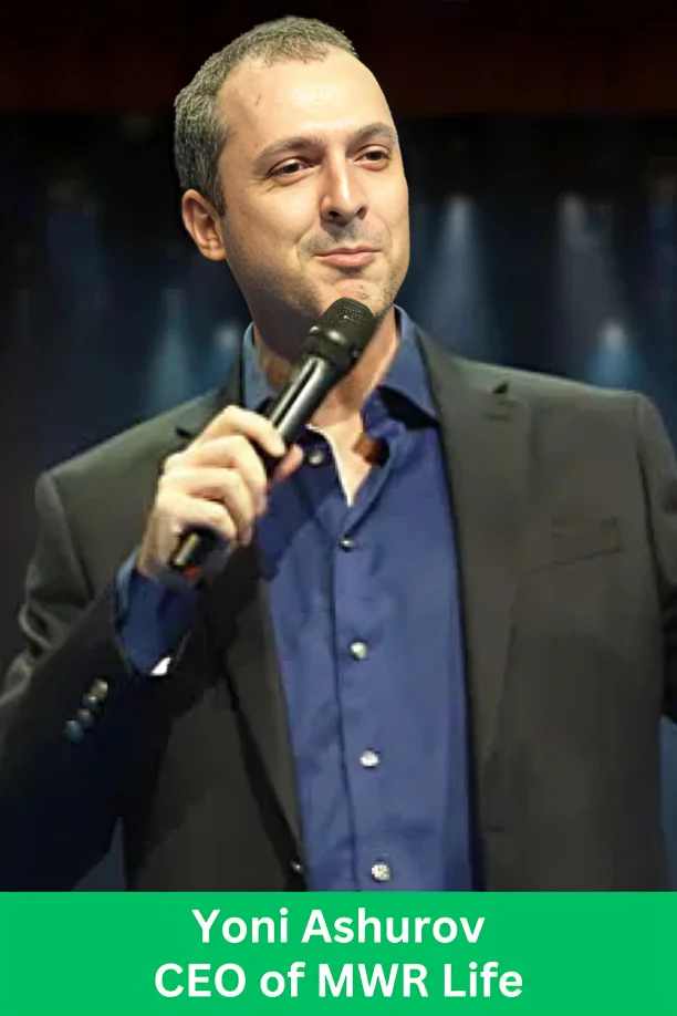 Yoni Ashurov, CEO of MWR Life, speaking on stage about leadership, travel innovation, and empowering global entrepreneurs