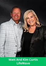 Two business leaders smiling together in a professional LifeWave-themed portrait