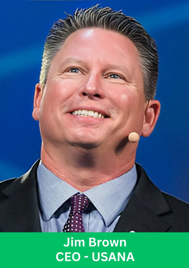 Business leader speaking on stage during a USANA leadership event