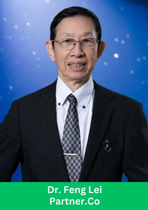 A professionally dressed individual standing in front of a blue background at a Partner.Co event