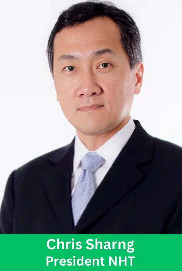 Chris Sharng President NHT wearing a black suit and light blue tie in a professional corporate headshot