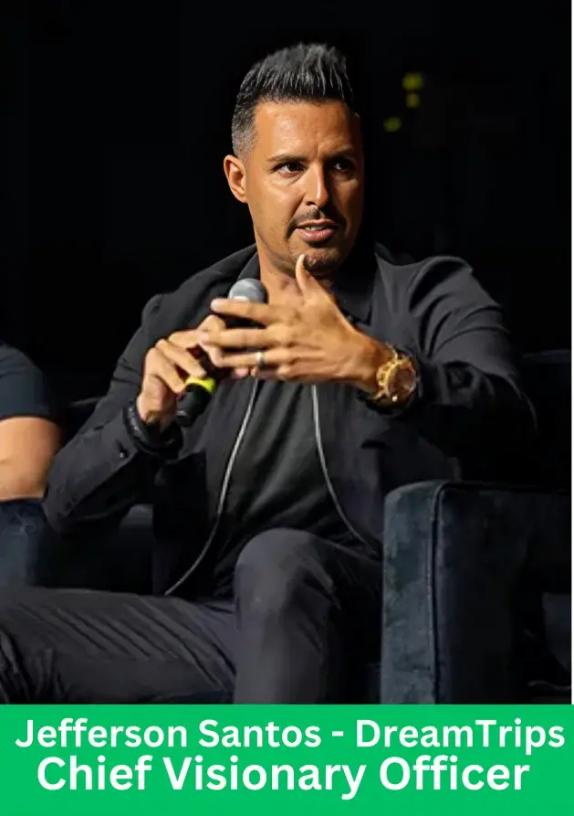 Jefferson Santos DreamTrips Chief Visionary Officer speaking at business event holding microphone