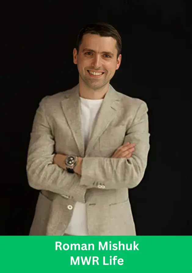Roman Mishuk smiling professional portrait for MWR Life branding with arms crossed.
