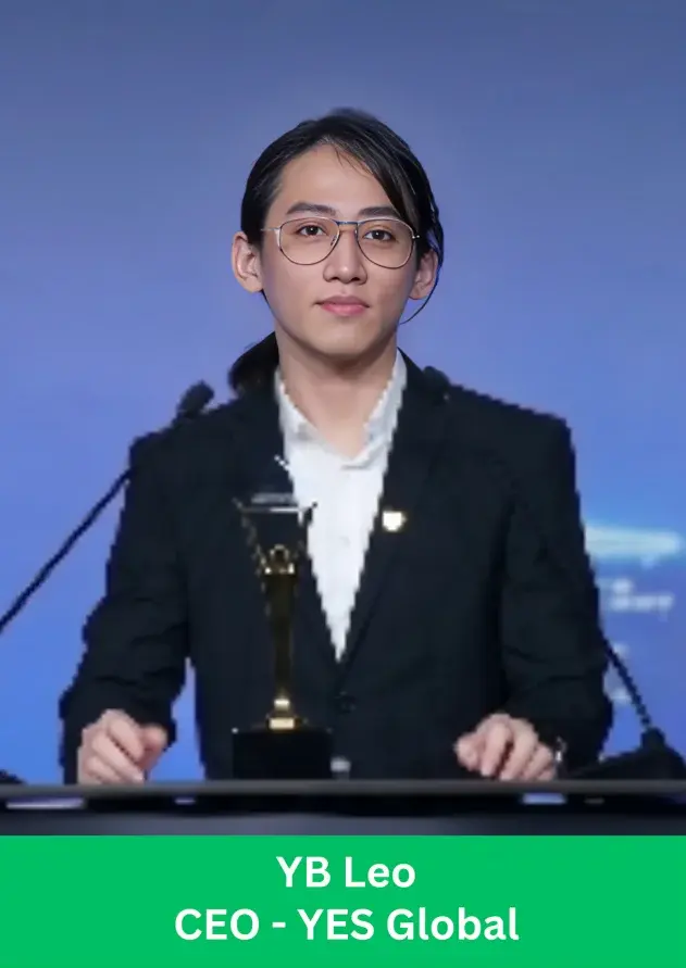 YB Leo CEO of YES Global speaking at podium during award ceremony with trophy
