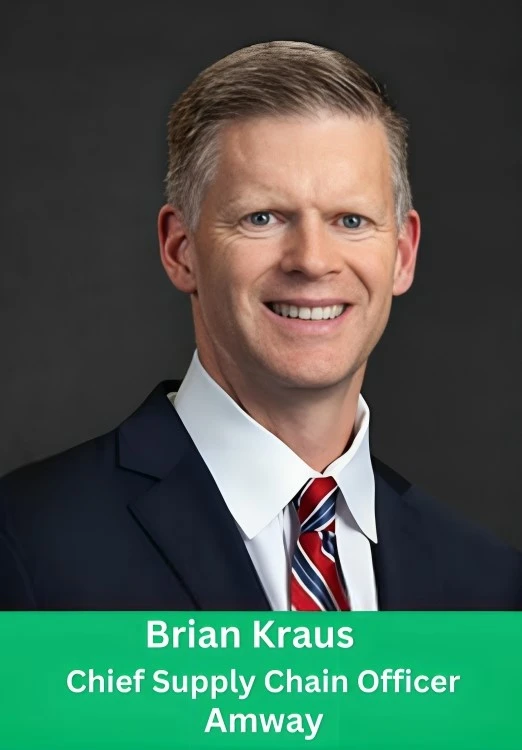 Professional portrait of Brian Kraus, Chief Supply Chain Officer of Amway, in a navy blue suit and striped tie.