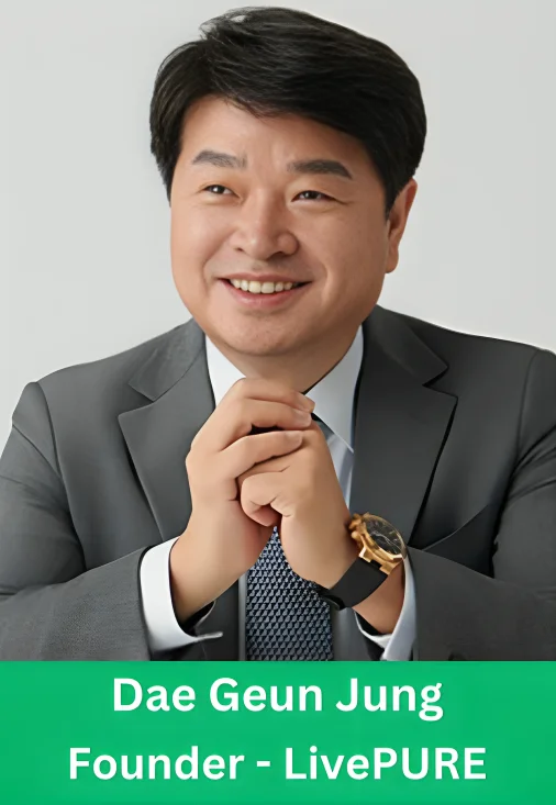 Dae Geun Jung, the founder of LivePURE, smiling in a grey corporate suit with clasped hands.