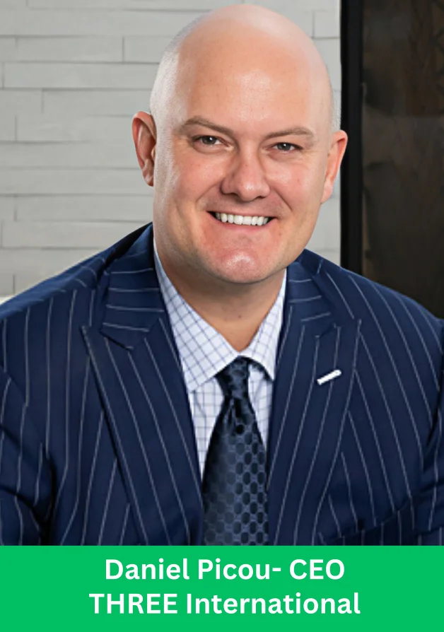 Daniel Picou professional portrait in pinstripe suit, CEO of THREE International