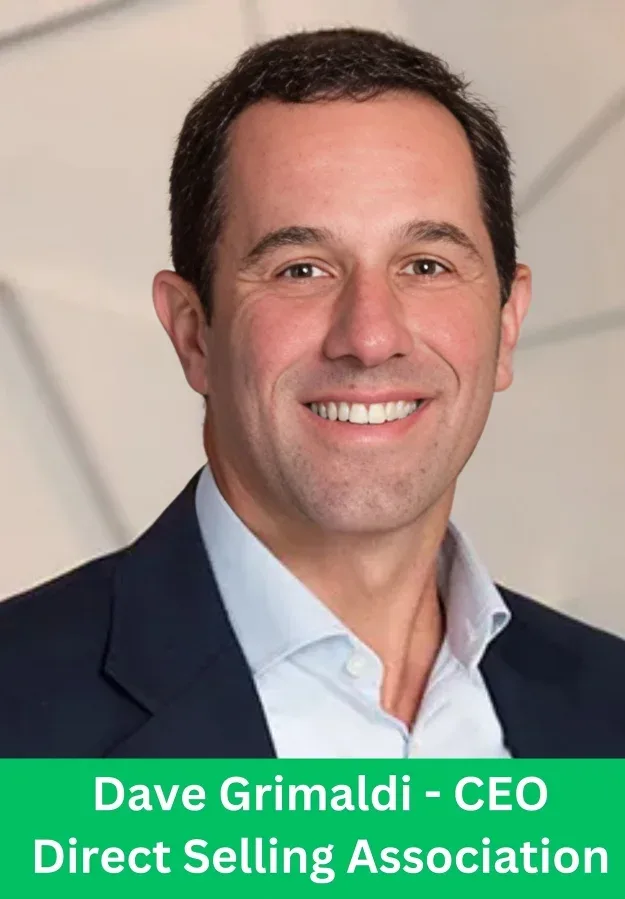 Dave Grimaldi CEO of Direct Selling Association smiling in a professional business portrait wearing a suit