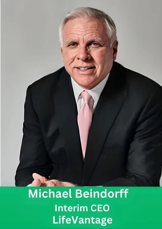 Professional portrait of Michael Beindorff, Interim CEO of LifeVantage, wearing a black suit and pink tie.