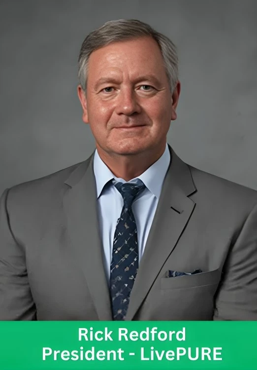 Professional headshot of Rick Redford, President of LivePURE, in a grey suit and tie.