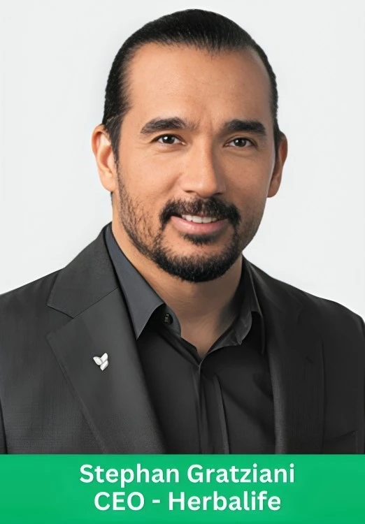 Professional portrait of Stephan Gratziani, CEO of Herbalife, wearing a black suit.