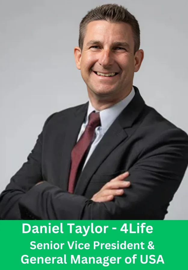Portrait of Daniel Taylor, Senior Vice President and General Manager of 4Life USA, wearing a professional suit.