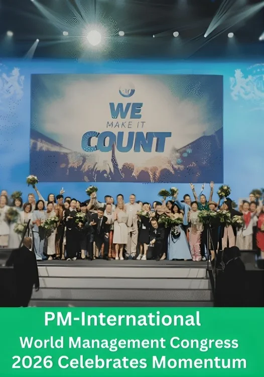 Participants celebrate on stage during the PM-International World Management Congress 2026 event featuring the “We Make It Count” theme and momentum achievements.