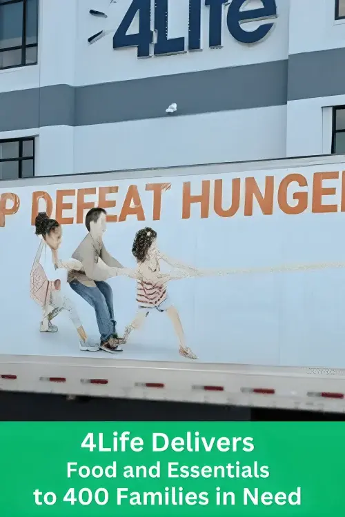 A 4Life delivery truck parked in front of the company building, featuring a graphic of children pulling a rope alongside the text Defeat Hunger. A green banner at the bottom reads 4Life Delivers Food and Essentials to 400 Families in Need.