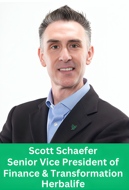 Professional corporate portrait of Scott Schaefer, Senior Vice President of Finance and Transformation at Herbalife, wearing a dark suit with a green lapel pin, against a white background.
